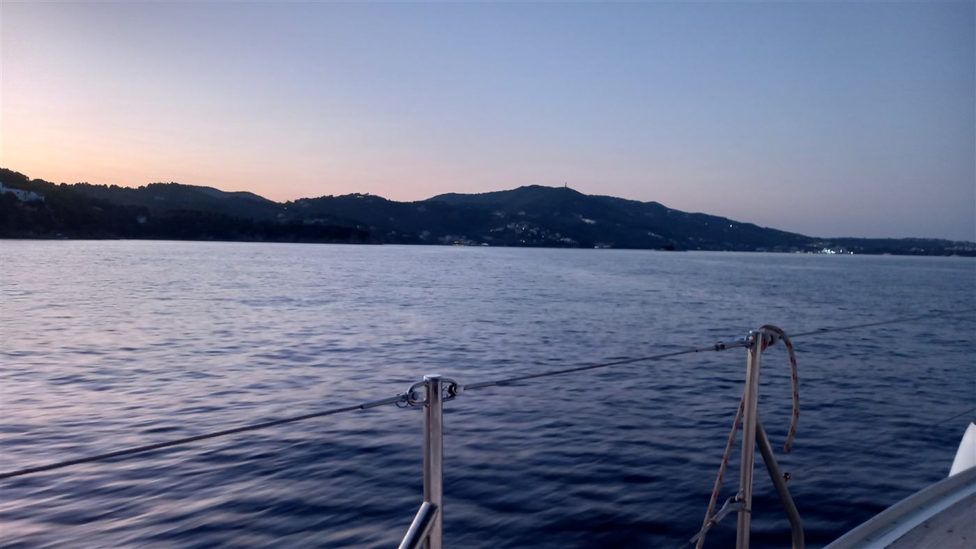 Dusk over the sea and distant coastline