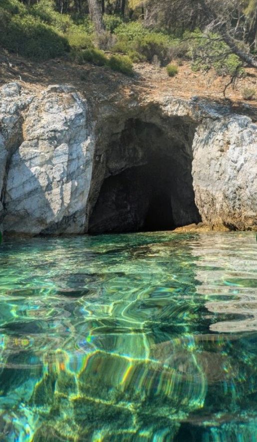 Emerald shallows glowing inside a sea cave