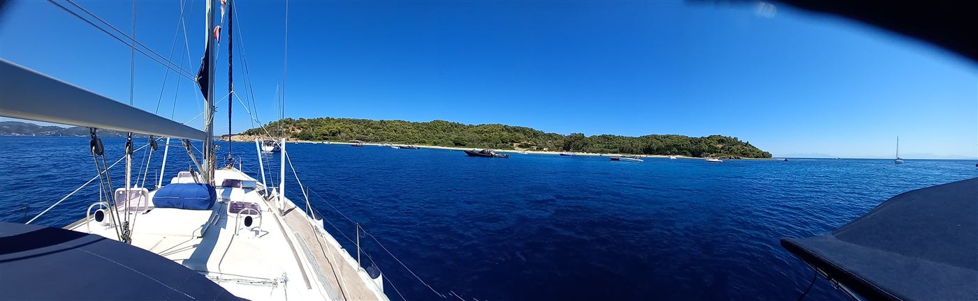 View from the deck toward a green island across the water