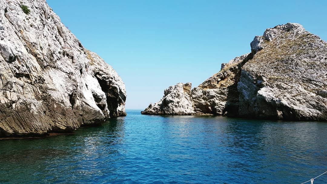 Weathered rock formations rising from the sea