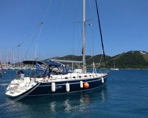 Yacht at her mooring with mountains beyond