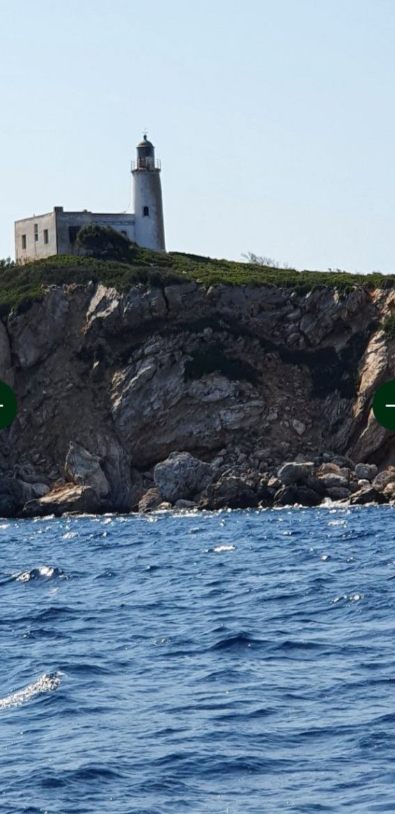 Lighthouse standing over the cliff edge